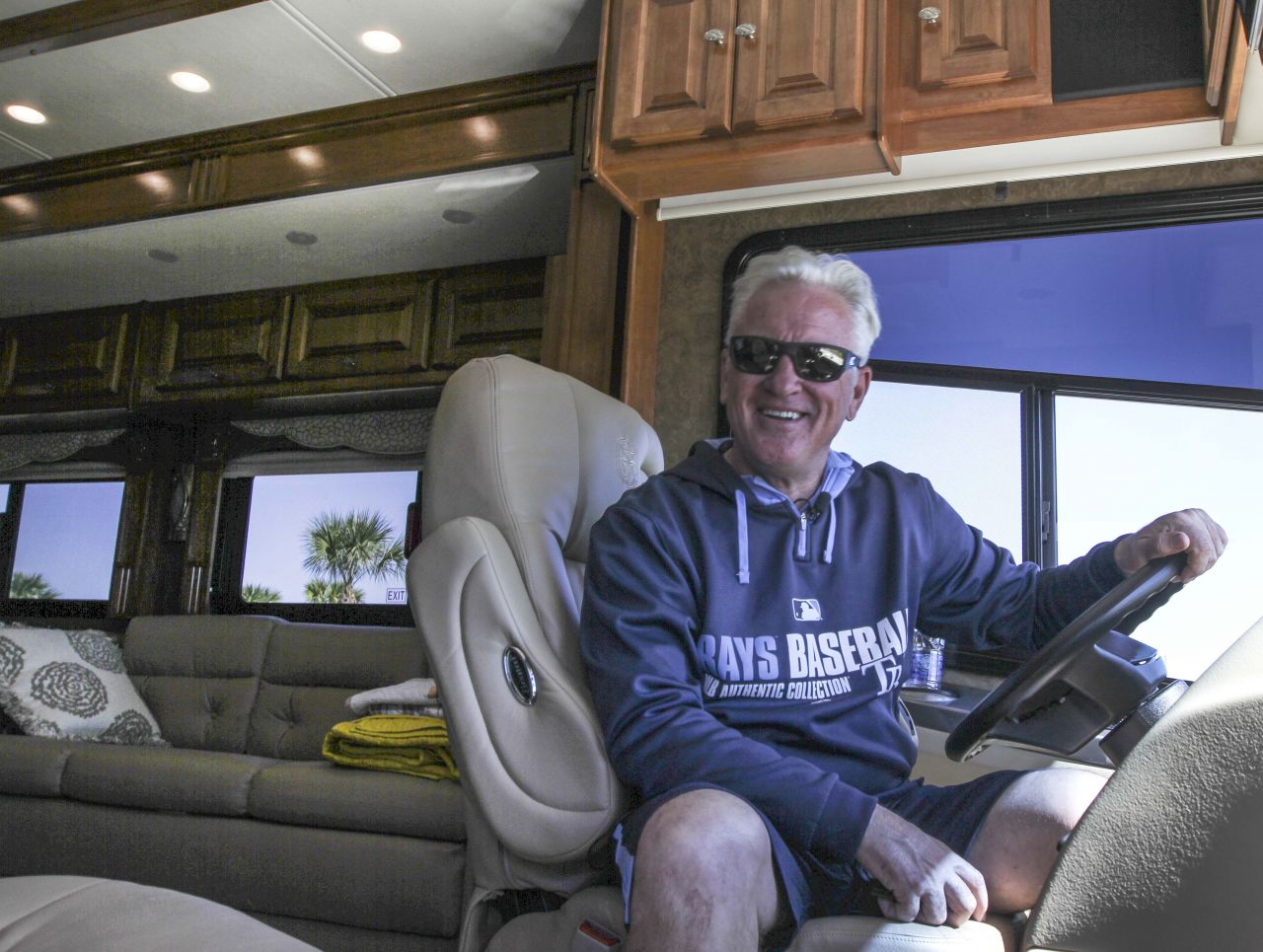 joe 1.jpg - Tampa Bay Rays Manager Joe Maddon mans the driver seat of his motor home after holding a  press conference at Charlotte Sports Park Friday to begin Spring Training.Photo by Tom O'Neill